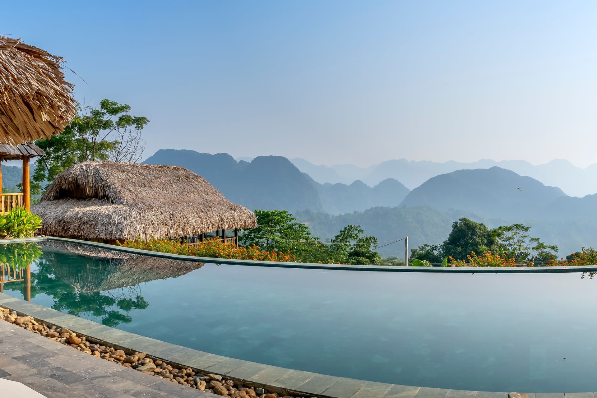 An infinity pool at a lodge in Pu Luong, Vietnam. Hotel category is the single biggest swing between two quotes for the same trip.