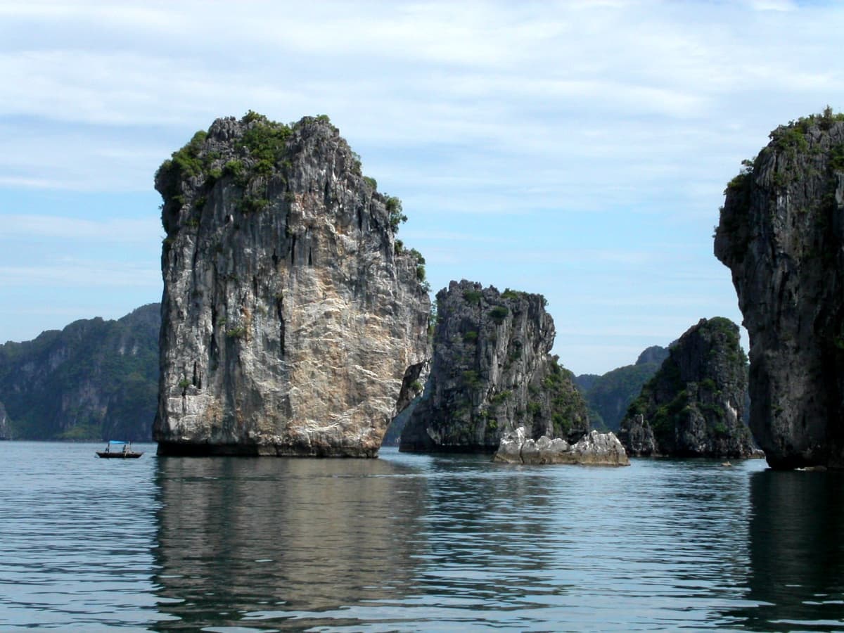 The karst towers of Ha Long Bay rise straight out of the water in northern Vietnam. A 45-day visa-free window is long enough to travel the country end to end.