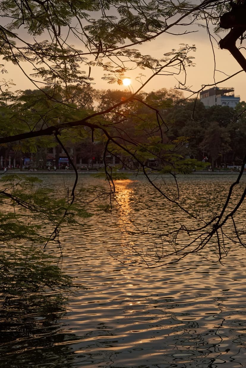 Hoan Kiem Lake at dusk in Hanoi, the northern gateway and launch point for Ha Long Bay.