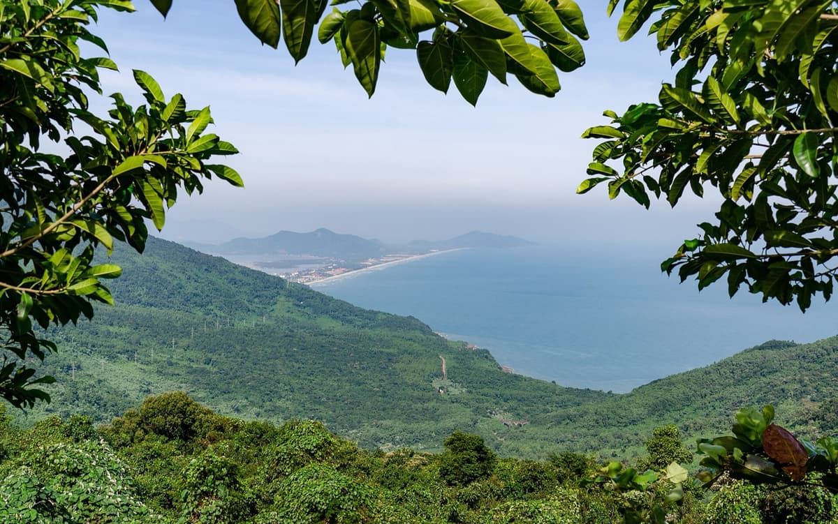 The same operator that meets the group in Thailand carries it through the Vietnamese leg, here the Hai Van Pass above Da Nang, under one escalation chain, not two.