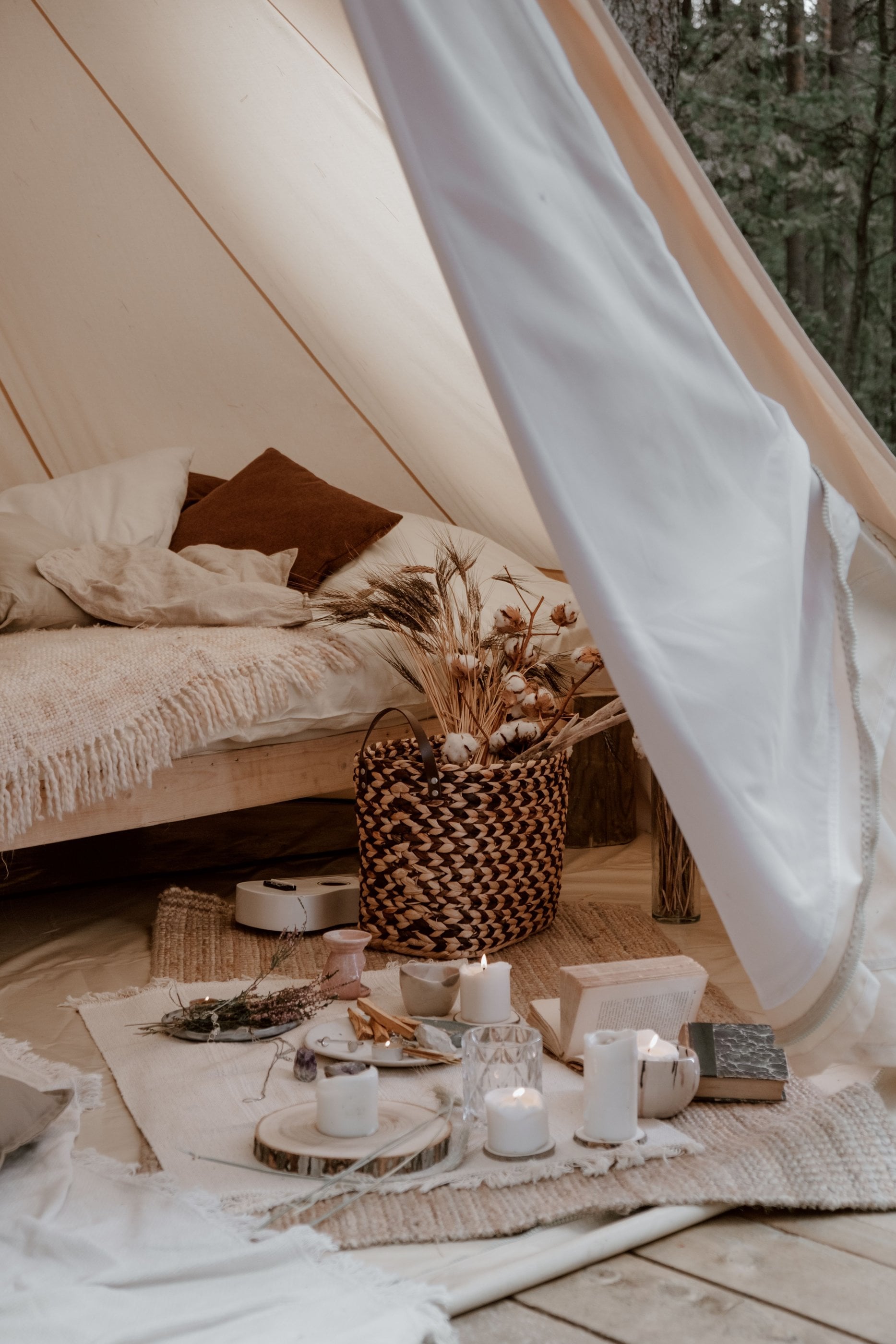 A candle-lit luxury tented camp interior, the register of a far-northern frontier overnight.