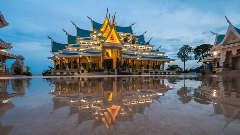 The vihara lit gold above its terrace at dusk; early morning and late afternoon are the quiet hours to visit.