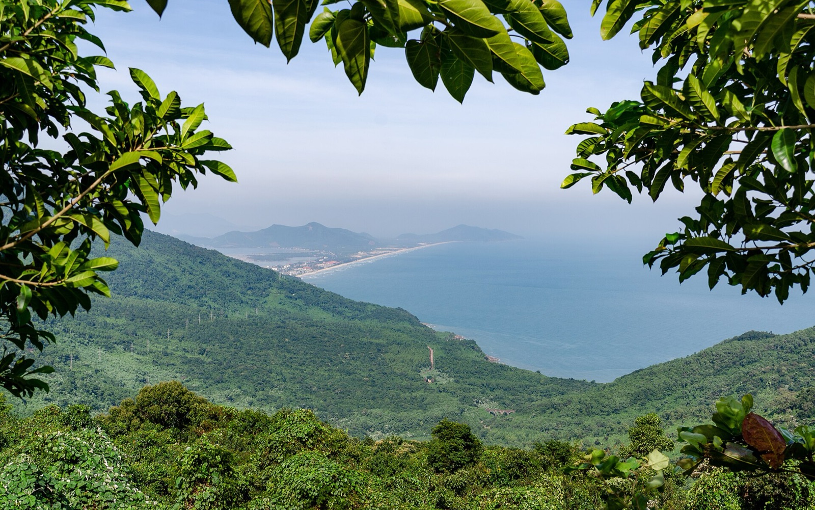 The same operator that meets the group in Thailand carries it through the Vietnamese leg, here the Hai Van Pass above Da Nang, under one escalation chain rather than two.